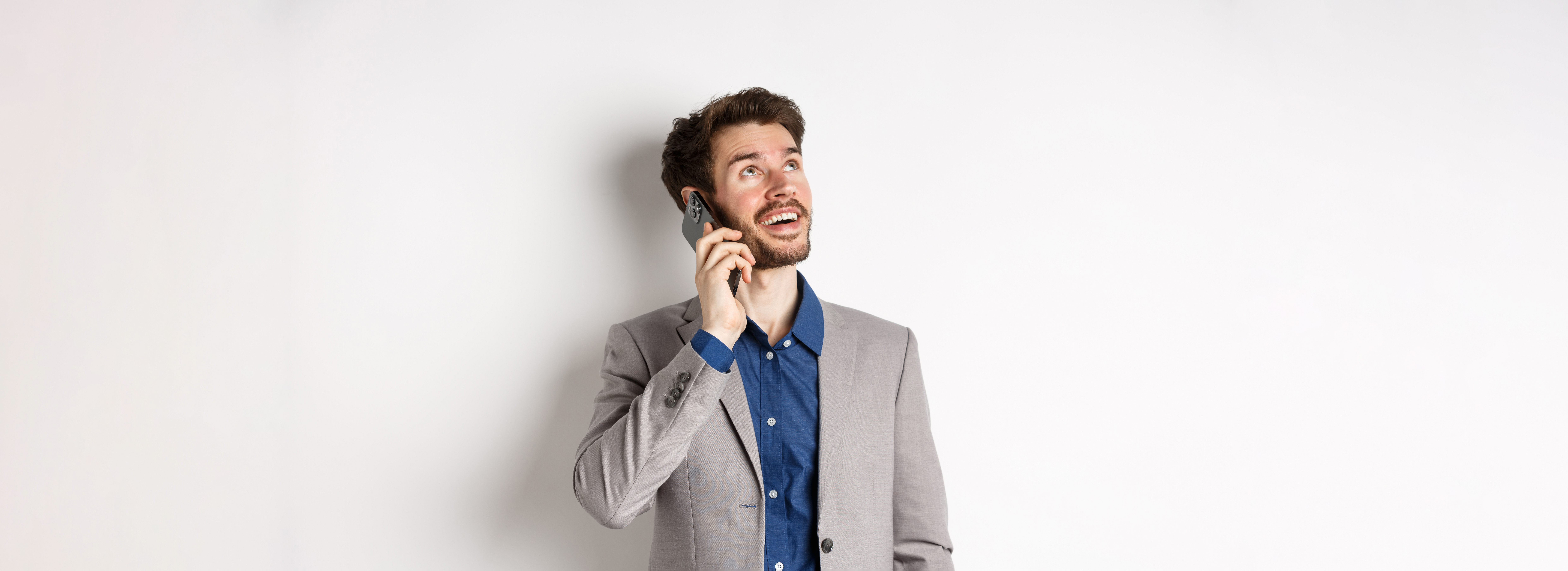 carefree-young-man-talking-mobile-phone-smiling-looking-up-with-dreamy-face-standing-suit.jpg carefree-young-man-talking-mobile-phone-smiling-looking-up-with-dreamy-face-standing-suit.jpg